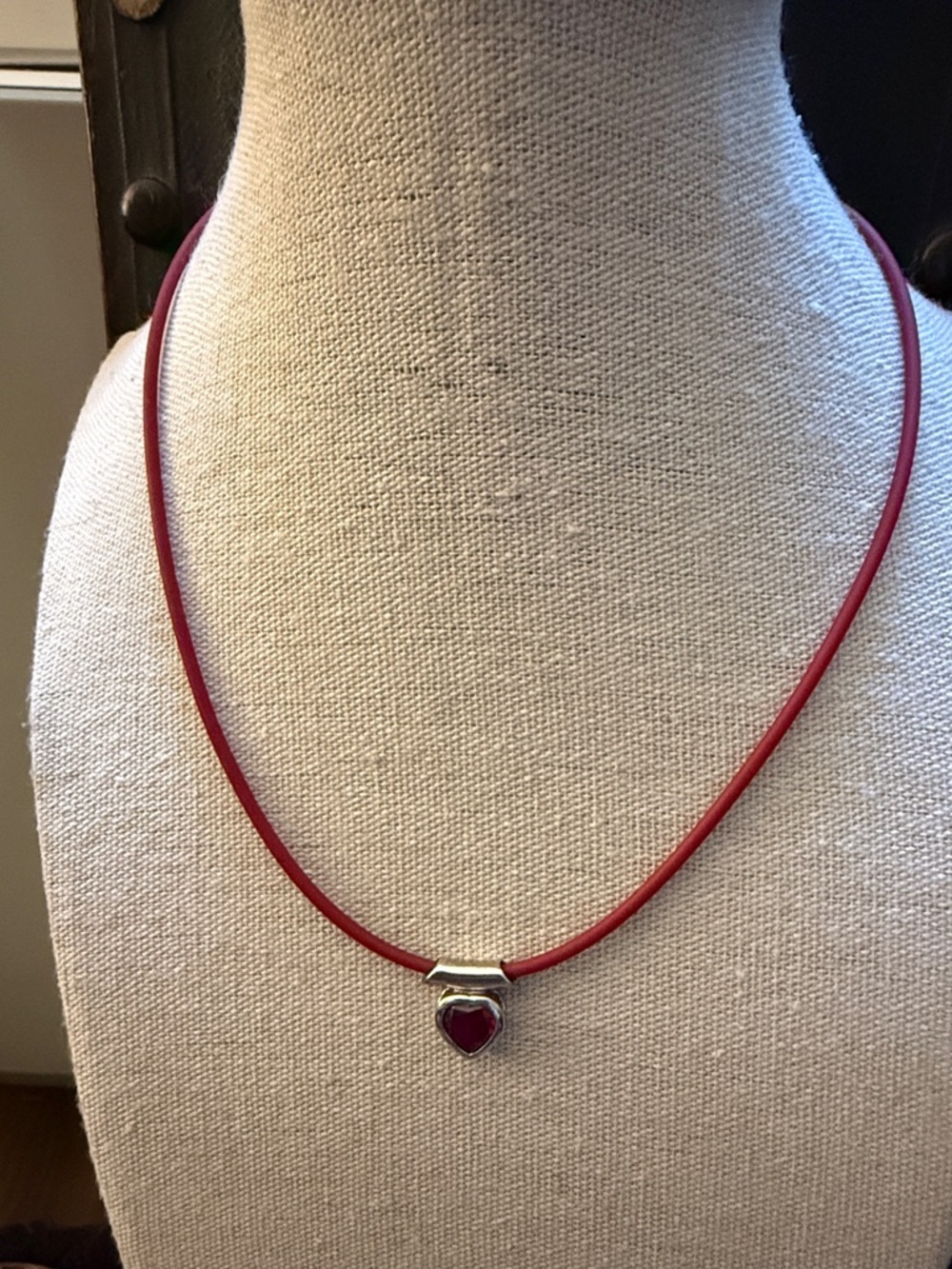 Sterling Silver Puffed Ruby Heart Pendant Necklace on Red Silicone Cord.